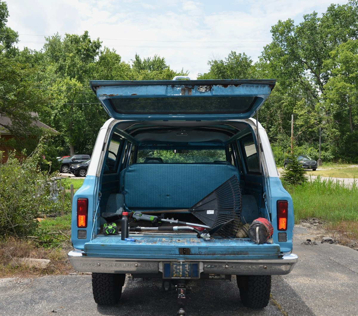 1972 Chevrolet 4x4 3 door Suburban in blue and white, rear view tailgate and hatch open related to Enhance Your Truck Storage with Bed Drawer Solutions