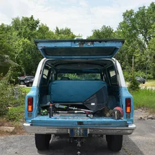 1972 Chevrolet 4x4 3 door Suburban in blue and white, rear view tailgate and hatch open related to Enhance Your Truck Storage with Bed Drawer Solutions