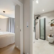 A bathroom with a toilet and a shower in it related to The Ultimate Guide to Bed Bath and Beyond Shower Curtains