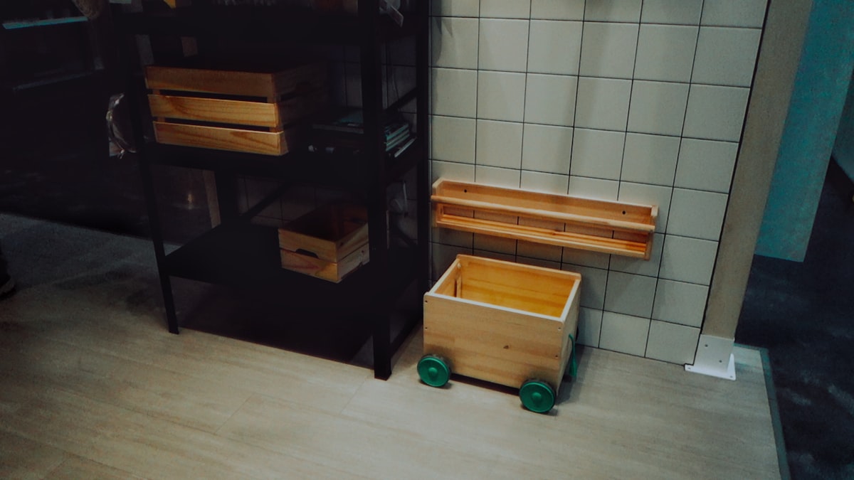 A bathroom with a toilet, sink, and shelves related to Optimize Your Space with Under Bed Drawers on Wheels