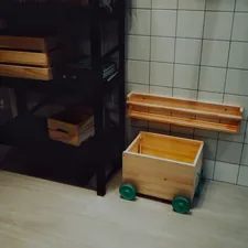 A bathroom with a toilet, sink, and shelves related to Optimize Your Space with Under Bed Drawers on Wheels