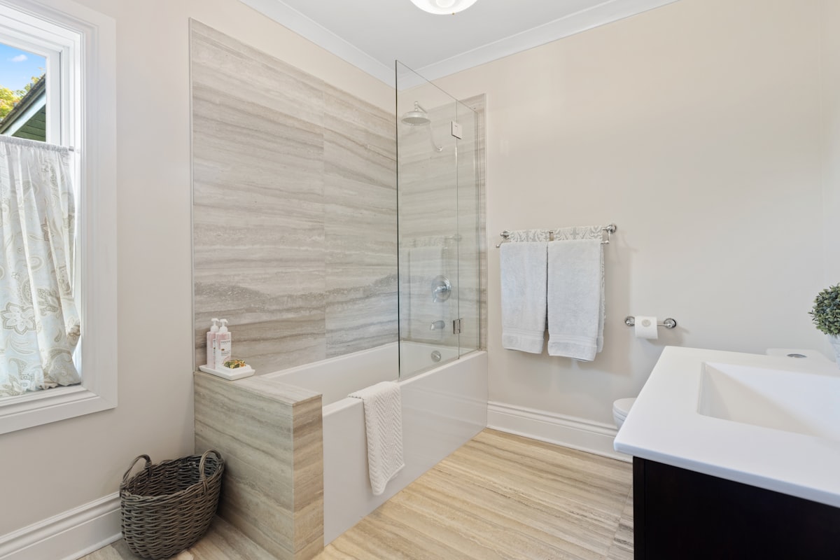 a bathroom with a tub, sink, and mirror related to Elegant Bathroom Shower Curtains with a Touch of Elegance