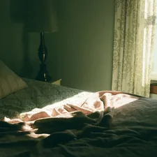 a bed with a blanket on it in a bedroom related to Discover the Ultimate Home Shopping Experience: Bed Bath and Beyond Near Me