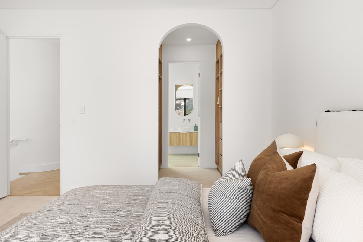 A bedroom with a bed and a mirror related to Spacious 3 Bed 3 Bath Rentals: Your Dream Home Awaits