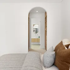 A bedroom with a bed and a mirror related to Spacious 3 Bed 3 Bath Rentals: Your Dream Home Awaits
