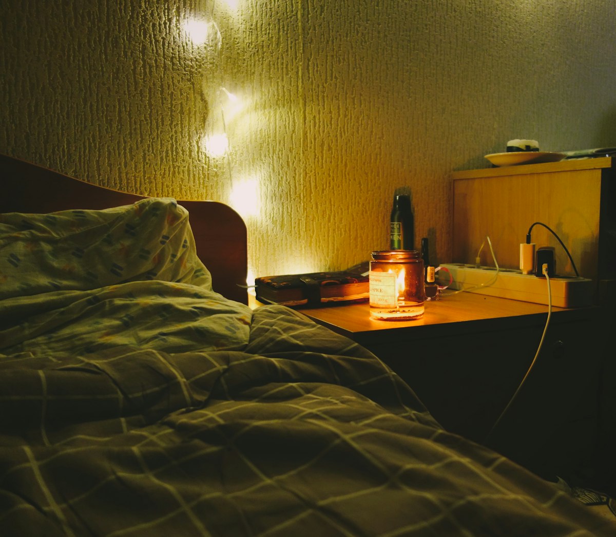 a bedroom with a bed and a night stand related to Brighten Up Your Bedroom with a Yellow Matelasse Coverlet