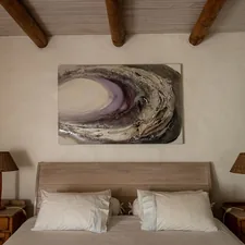 A bedroom with a bed and a painting on the wall related to Discover Tranquility at Casa de Sueños Bed and Breakfast