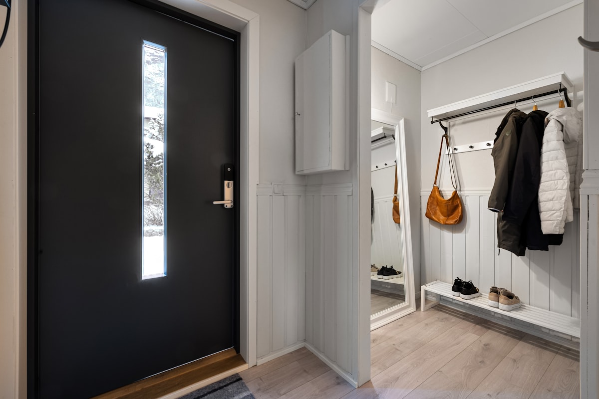 A black and white door and some clothes related to Elevate Your Home's First Impression: Entryway Hall Tree with Storage