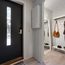 A black and white door and some clothes related to Elevate Your Home's First Impression: Entryway Hall Tree with Storage