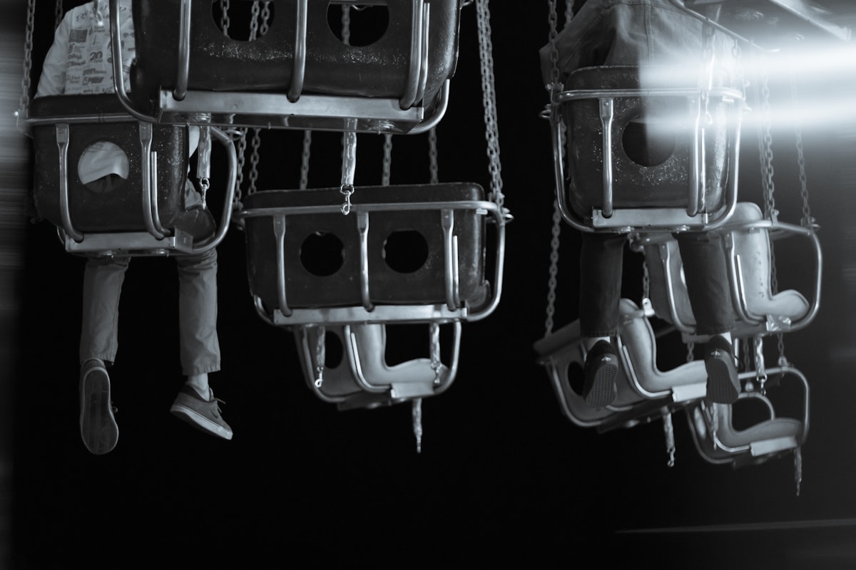 A black and white photo of a man on a ferris wheel related to The Ultimate Space-Saver: 3 Beds in One