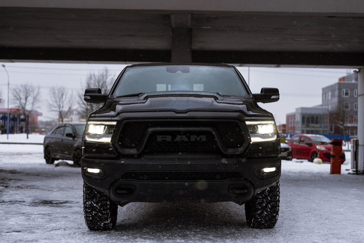 a black ram truck parked under a bridge related to Enhance Your Dodge Ram 1500: The Ultimate Guide to Bed Liners