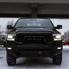 a black ram truck parked under a bridge related to Enhance Your Dodge Ram 1500: The Ultimate Guide to Bed Liners