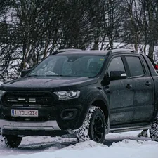 a black truck is parked in the snow related to 2004 Ford Ranger Bumper Valance