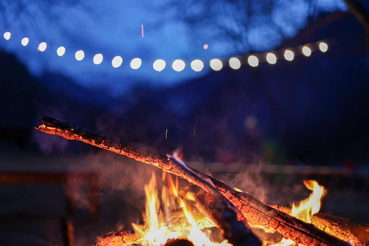 a blurry photo of a fire related to Warm Up Your Outdoor Evenings with a Rustic Clay Chiminea