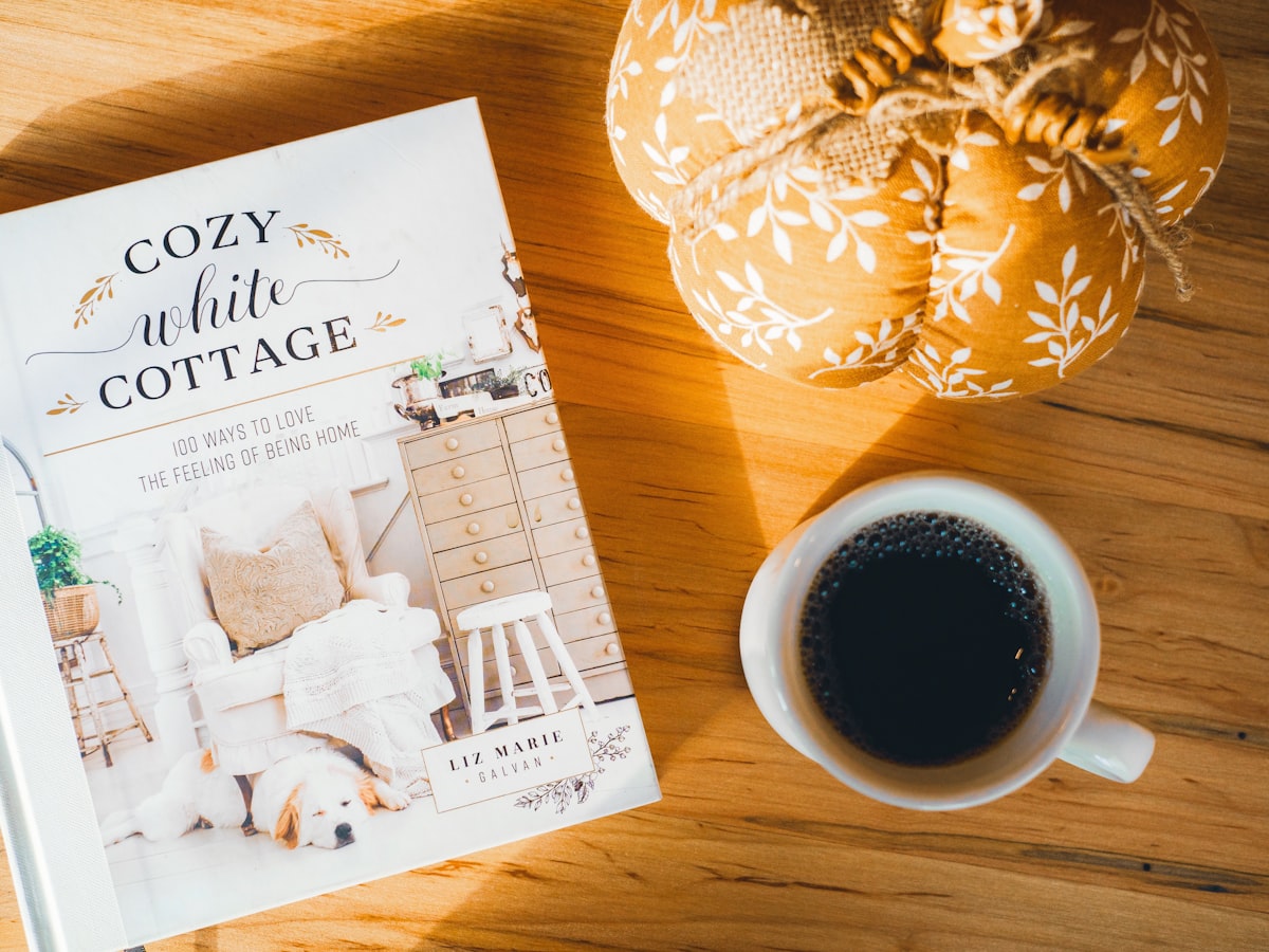 a book and a cup of coffee related to Cozy Delights: Finding the Perfect Bed and Breakfast in OKC