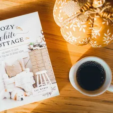 a book and a cup of coffee related to Cozy Delights: Finding the Perfect Bed and Breakfast in OKC