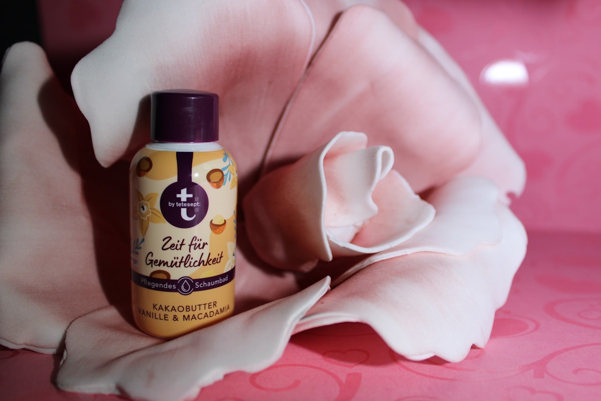 a bottle of deodorant sitting on top of a bed related to The Best Tanning Bed Lotion for Fair Skin: Achieve a Gorgeous Glow Safely
