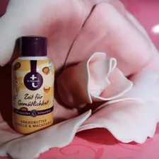 a bottle of deodorant sitting on top of a bed related to The Best Tanning Bed Lotion for Fair Skin: Achieve a Gorgeous Glow Safely