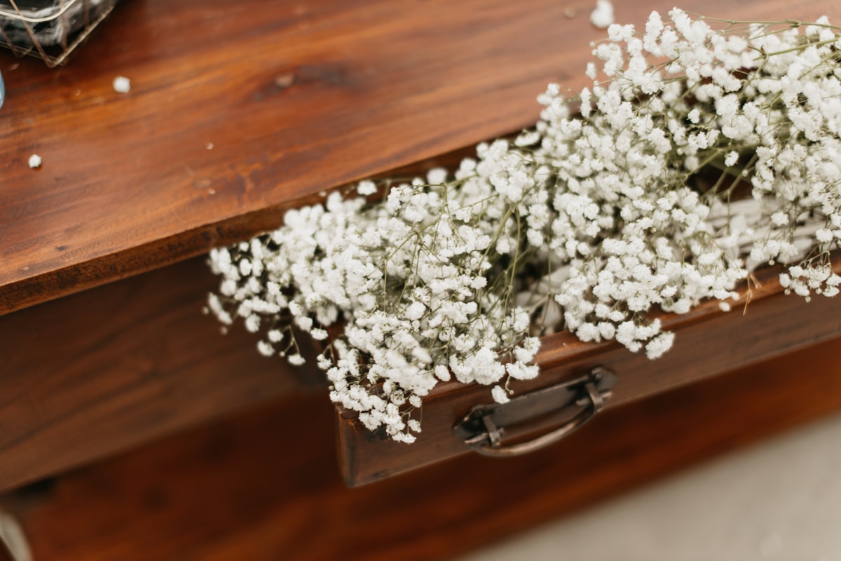 a bouquet of white flowers related to Rustic Sideboards and Buffets: Bringing Charm to Your Home