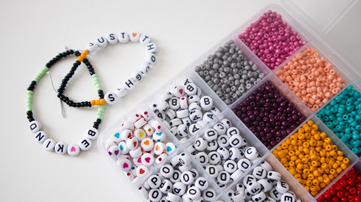 a box filled with lots of different colored beads related to Create Your Own Custom Valance Board