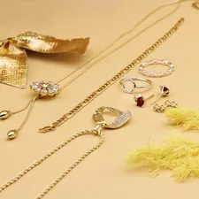 a bunch of jewelry laying on a table related to Maximize Your Space: The Ultimate Guide to Bed Bath and Beyond Jewelry Organizers