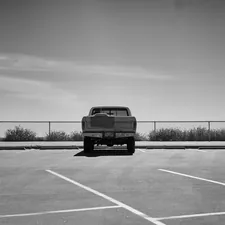 a car parked in a parking lot related to Durable Solutions for Your Hauling Needs