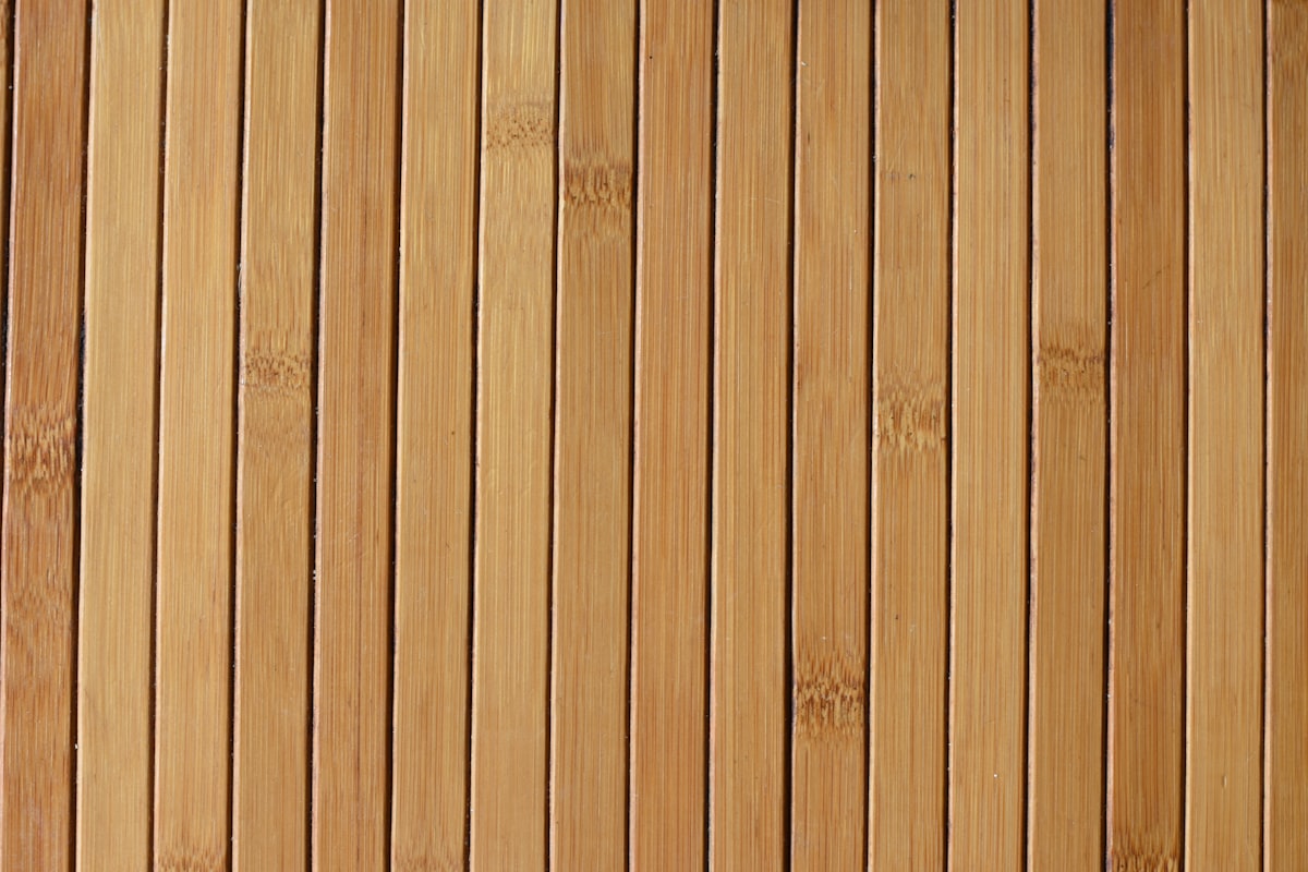 a cat laying on top of a wooden floor related to Streamline Your Entryway with a Bamboo Organizer