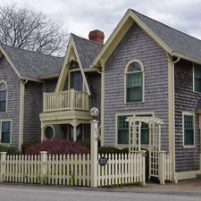 A charming house with a white picket fence. related to Cozy Getaways: Discover the Best Bed and Breakfast in New Orleans