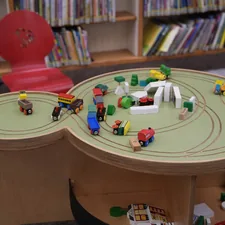 A child's table with a toy train set on it related to Maximizing Space with an Under Bed Train Table: The Ultimate Storage Solution