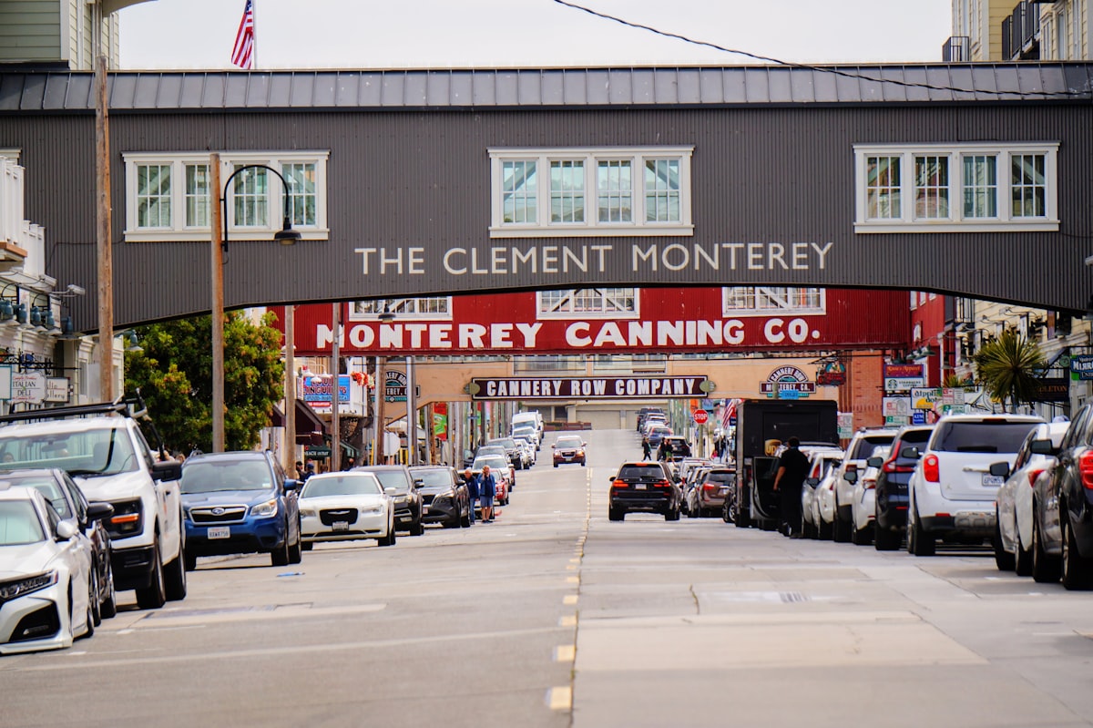 A city street filled with lots of traffic under a bridge related to Discover the Charm of Monterey: Top Bed and Breakfast Options