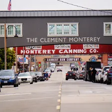 A city street filled with lots of traffic under a bridge related to Discover the Charm of Monterey: Top Bed and Breakfast Options