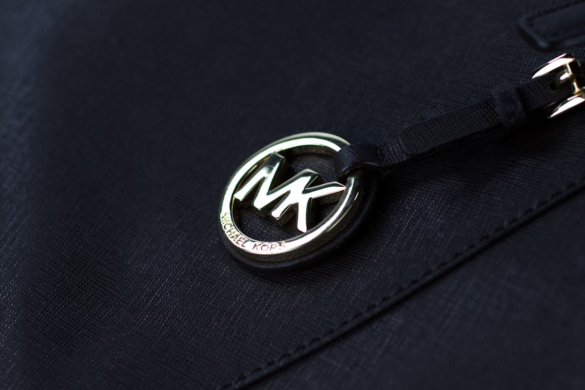 a close up of a badge on a jacket related to Transform Your Bedroom with Michael Kors Bedding