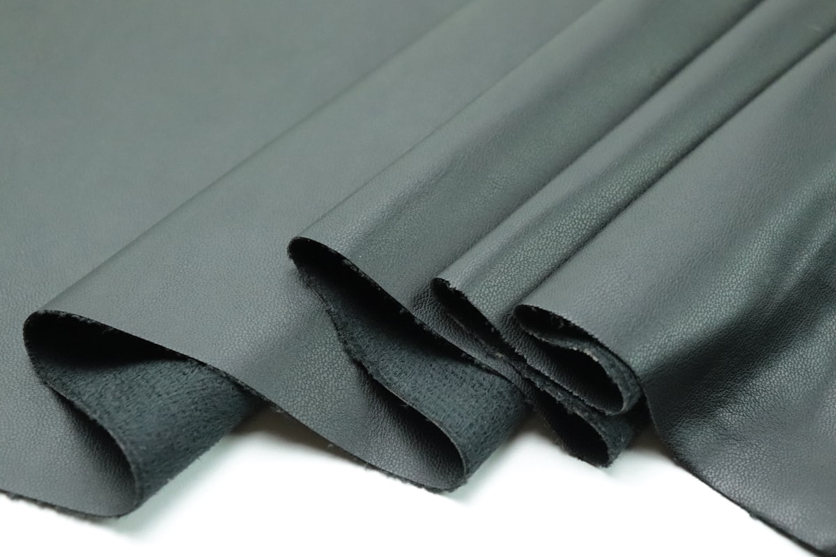 a close up of a black cloth on a white surface related to The Ultimate Guide to Rubber Bed Liners: Protecting Your Truck Bed