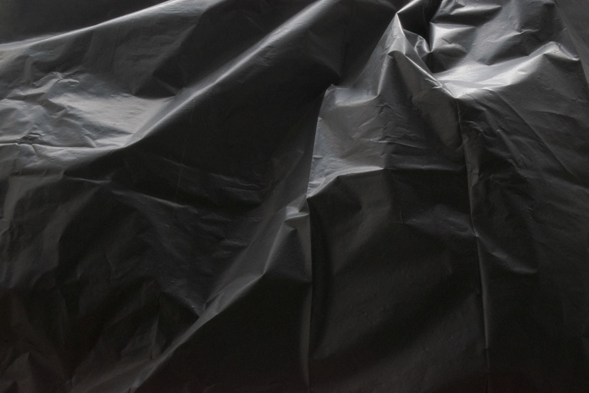 a close up of a black plastic bag related to The Ultimate Guide to Plastic Bed Liners