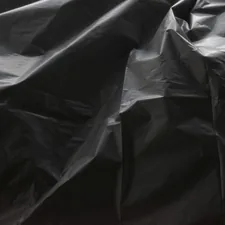 a close up of a black plastic bag related to The Ultimate Guide to Plastic Bed Liners