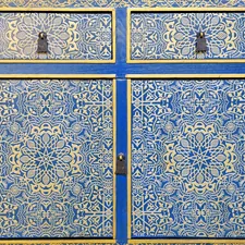 A close up of a blue and yellow cabinet related to Spanish Style Sideboards: Adding a Touch of Andalusian Elegance to Your Home