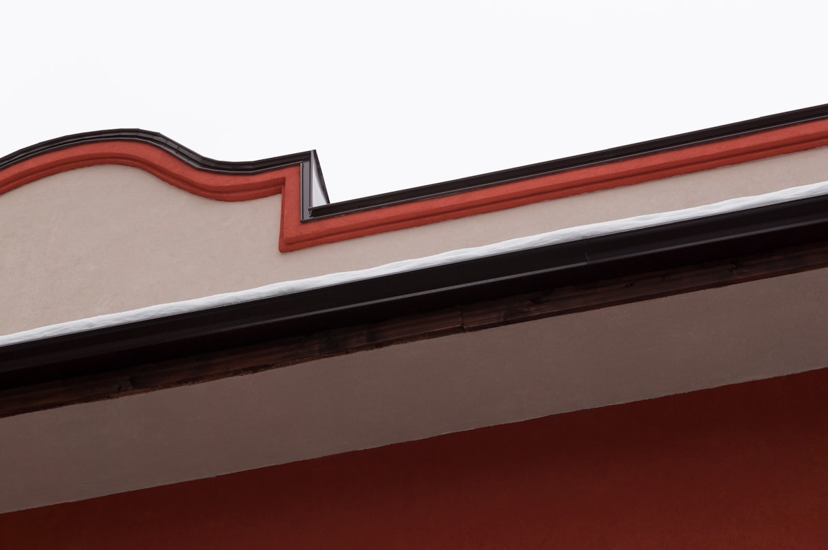 a close up of a building with a clock on the side of it related to How to Make a Cornice Board Valance