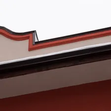a close up of a building with a clock on the side of it related to How to Make a Cornice Board Valance