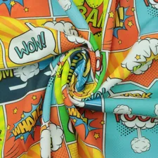 a close up of a colorful fabric with comic characters on it related to Unleash Your Inner Hero with Superhero Full Size Bedding