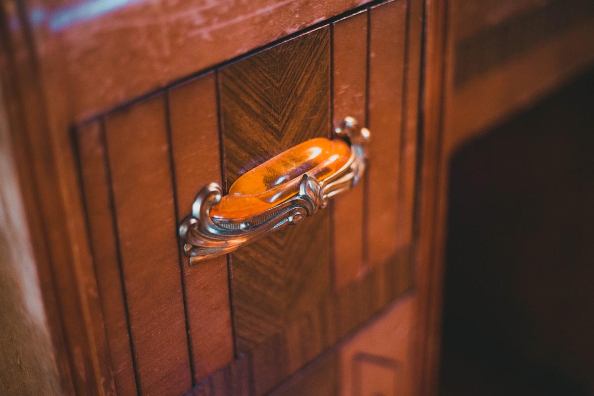 a close up of a door handle on a wooden door related to The Timeless Elegance of Antique Buffet Sideboards