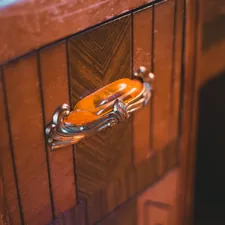 a close up of a door handle on a wooden door related to The Timeless Elegance of Antique Buffet Sideboards