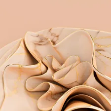 A close up of a flower on a plate related to Wrap Yourself in Opulence: The Luxury of Gold Bedding