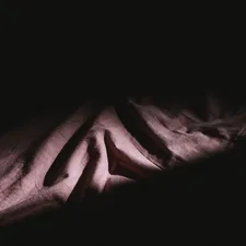 a close-up of a hand related to Stylish Black and Pink Bedding Options
