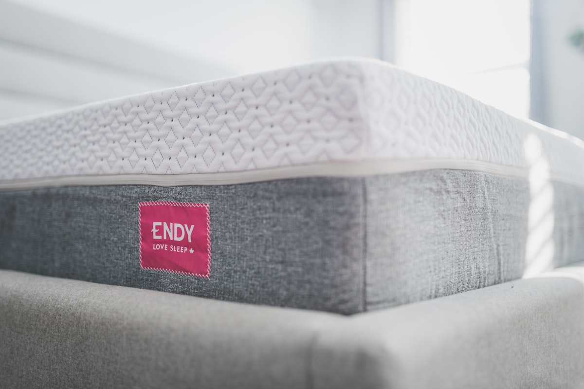 a close up of a mattress with a red label on it related to Unlock Exclusive Savings: Bed Bath & Beyond Coupon Guide