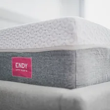 a close up of a mattress with a red label on it related to Unlock Exclusive Savings: Bed Bath & Beyond Coupon Guide