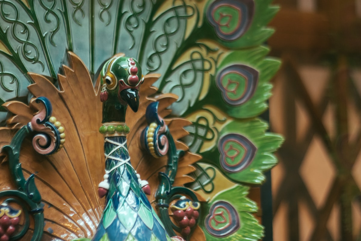 a close up of a peacock statue on display related to Elegant Nursery Themes Inspired by Nature