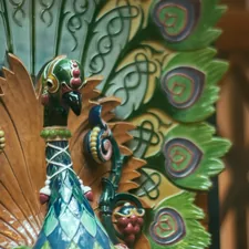 a close up of a peacock statue on display related to Elegant Nursery Themes Inspired by Nature