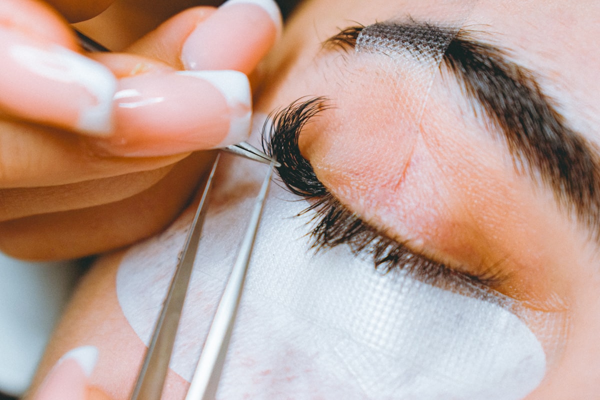 A close up of a person cutting a persons eye related to Coverlet Eye Patches: Expertly Crafted for Optimal Comfort