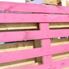 a close up of a pink wooden fence related to How to Make a Pallet Bed: 5 Creative Ideas