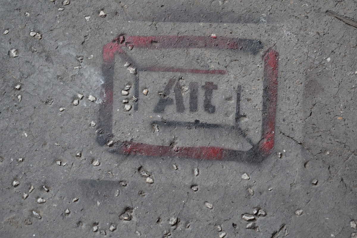 a close up of a street sign on the ground related to How to Effectively Patch Your Air Bed: A Step-by-Step Guide